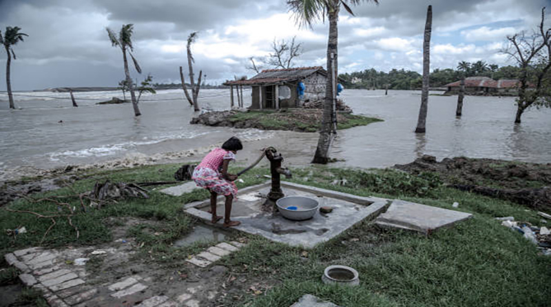 A local village girl is trying to pump up water from the tube well. Here, people face an extreme crisis of drinking water because due to the rising sea, the salinity of underground water has increased a lot.